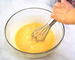 Custard ingredients whisked together until smooth in a mixing bowl - Hostess At Heart
