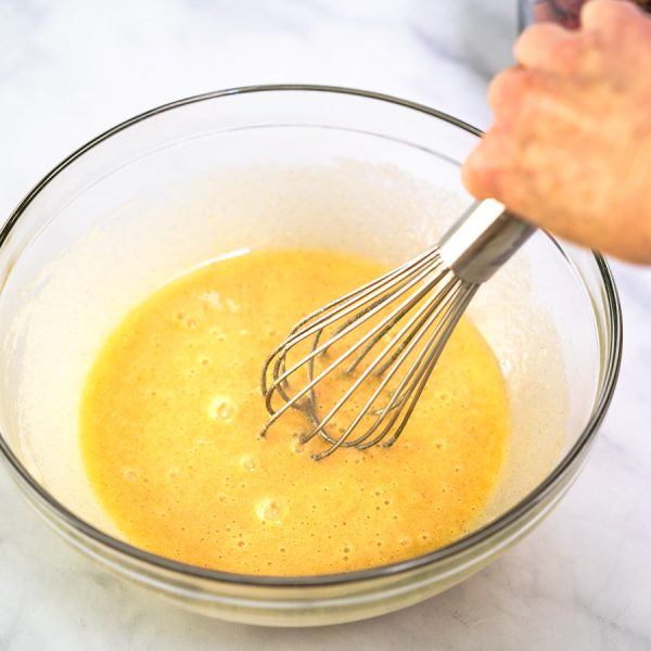 Custard ingredients whisked together until smooth in a mixing bowl - Hostess At Heart
