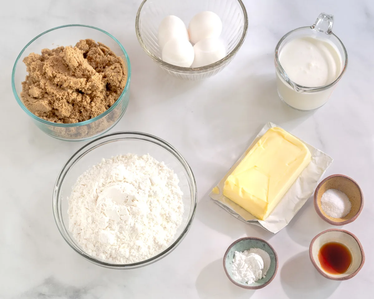 Ingredients used to make Cuban Rum Cake from scratch including Salt, baking powder, flour, unsalted butter, brown sugar, Eggs, vanilla Extract, and whipping cream. Hostess At Heart