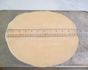 Pie crust rolled into an 11-1/2 inch circle and placed on the back of a baking sheet. Hostess At Heart