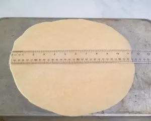 Pie crust rolled into an 11-1/2 inch circle and placed on the back of a baking sheet. Hostess At Heart