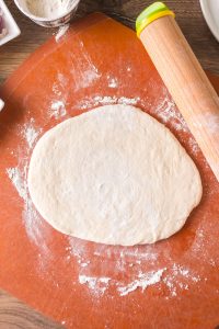 A rolled homemade sour dough pizza crust - Hostess At Heart