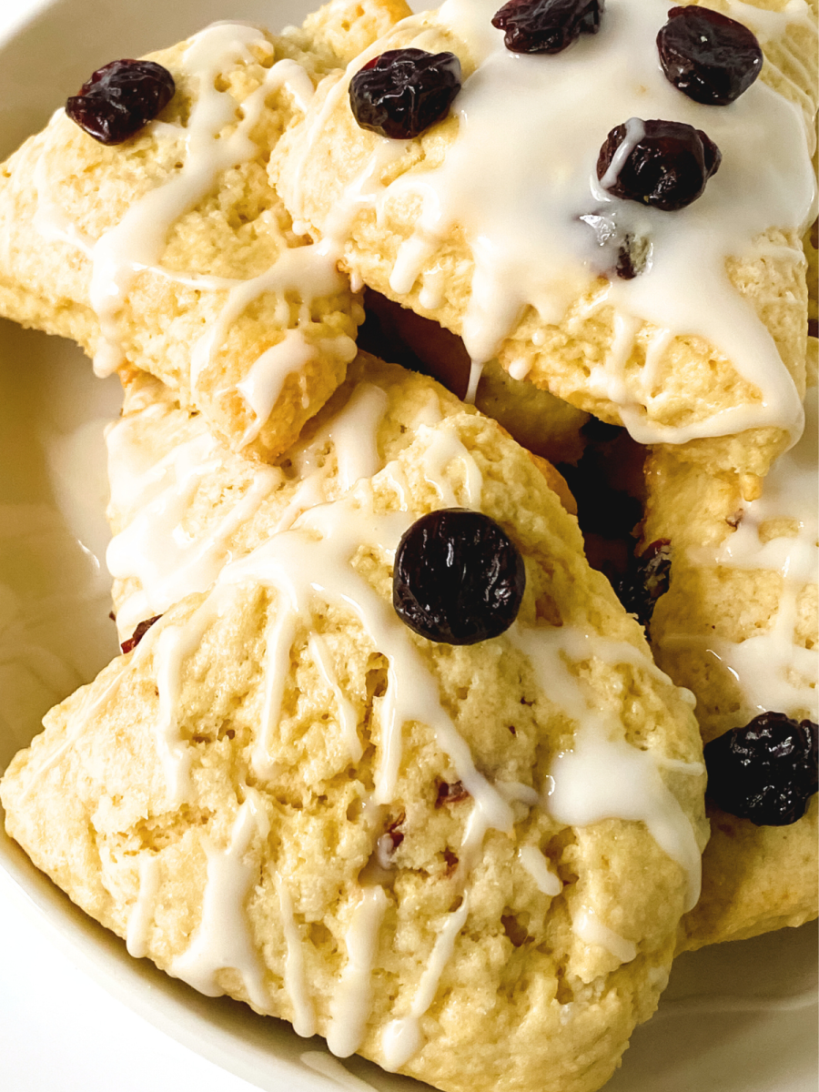 Sideview of scone wedges glazed and topped with cherries - Hostess At Heart
