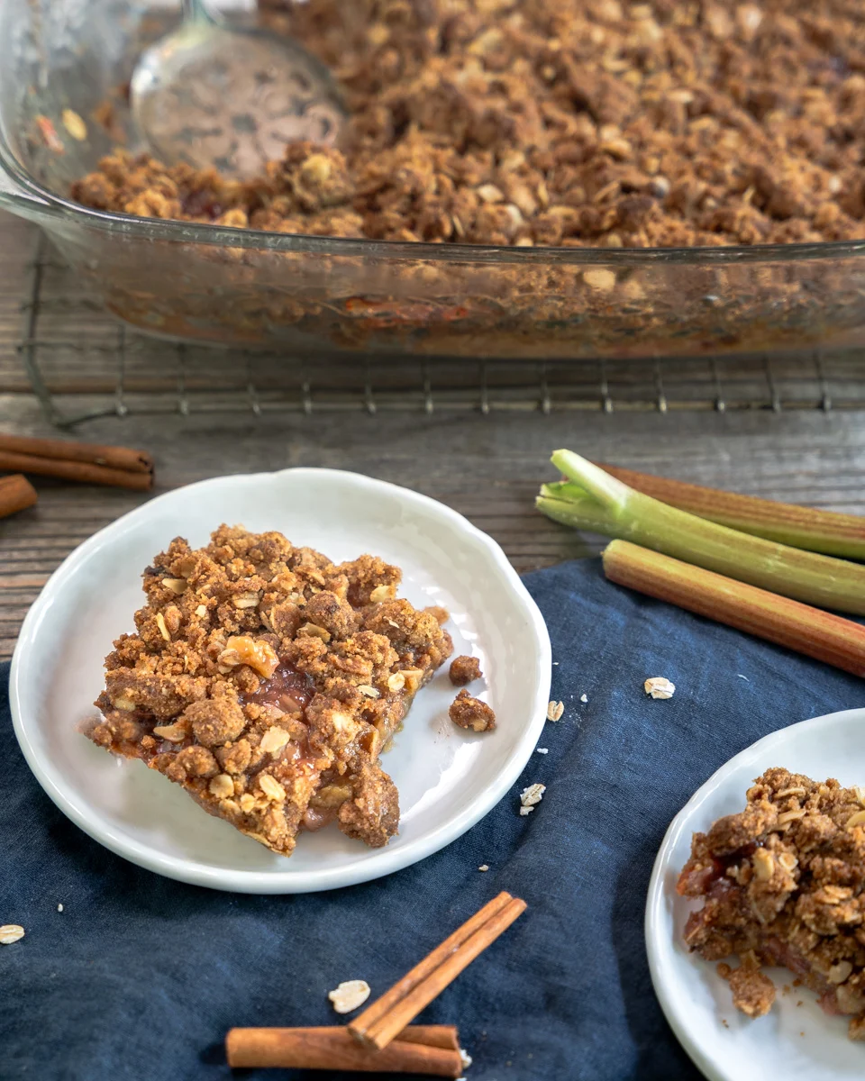Top down angled view of rhubarb crumble bars with oat crisp topping - Hostess At Heart