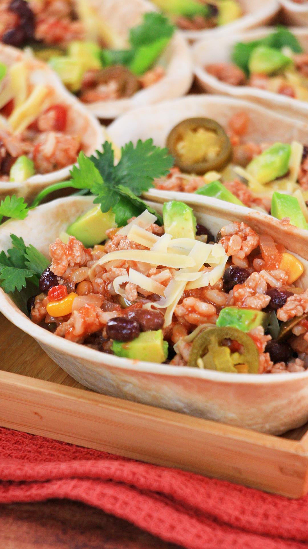 Green Chili Pork filling with beans and corn in taco shells - Hostess At Heart