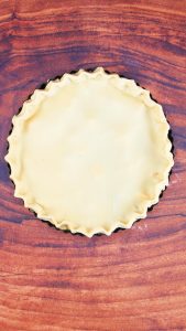 Top down view of a pie covered with a pastry crust - Hostess At Heart