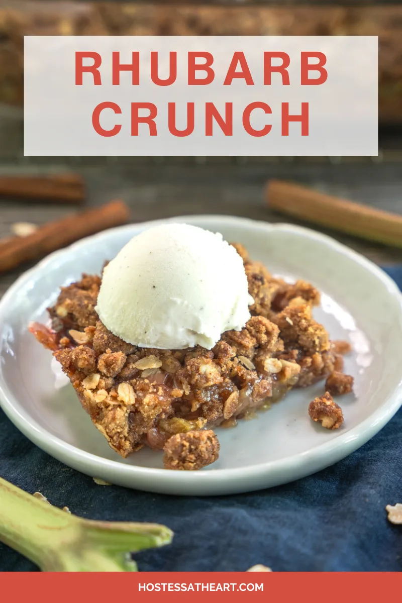 Angled view of a slice of rhubarb crisp topped with vanilla bean ice cream - Hostess At Heart