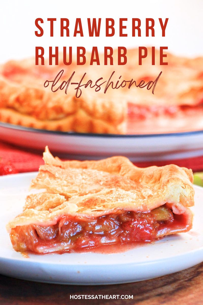 Sideview of a slice of strawberry rhubarb pie with the juices surrounding the slice on a plate - Hostess At Heart