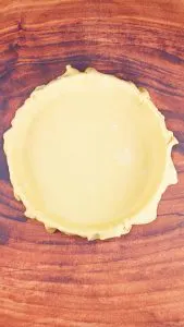 A bottom pie dough crust layered over a pie plate. Hostess At Heart