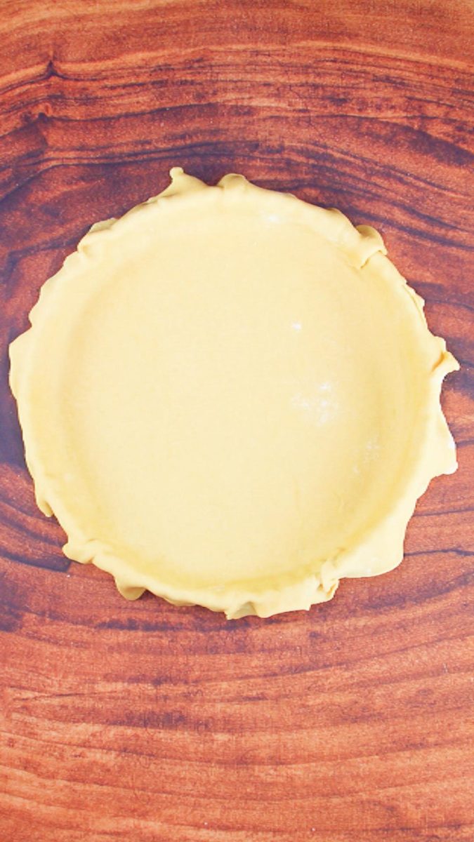 A bottom pie dough crust layered over a pie plate. Hostess At Heart