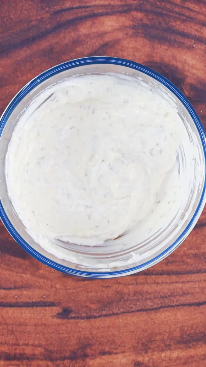 A bowl filled with homemade greek yogurt sauce - Hostess At Heart