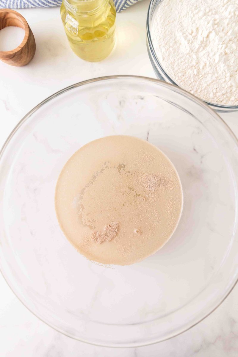 Yeast activated with warm water in a mixing bowl.