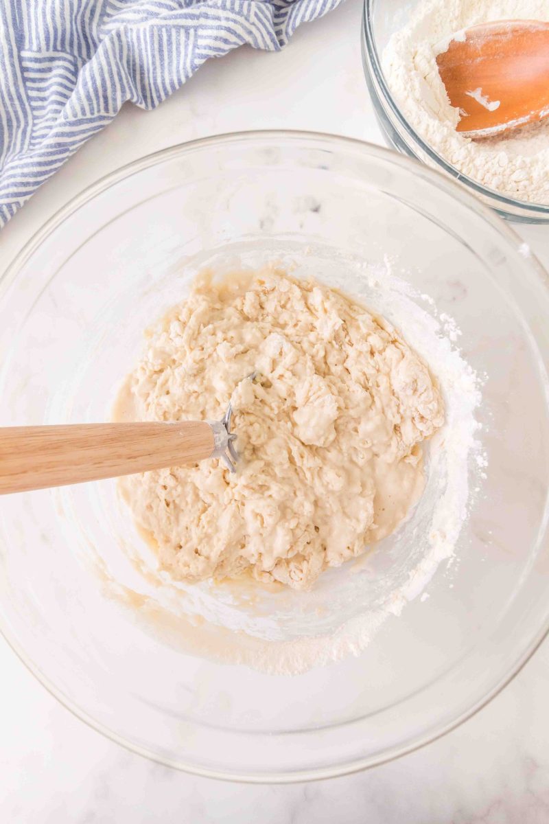 French bread ingredients being mixed into a wet dough in a mixing bowl &ndash; Hostess At Heart