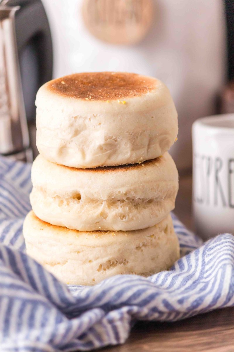 Three English Muffins made with sourdough starter stacked ontop of one another - Hostess At Heart