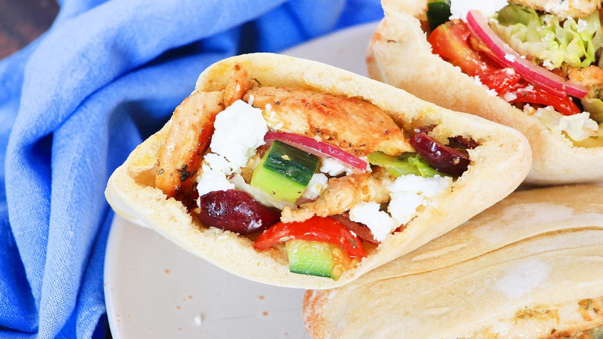 Top down view of Greek Pocket Bread filled with chicken and veggies - Hostess At Heart