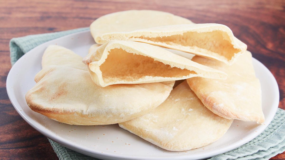 The results of this easy Pita Bread Recipe are stacked on a plate.