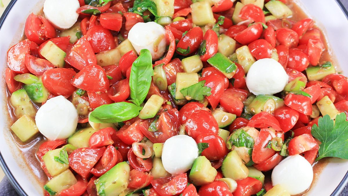 Close up of Italian Tomato Mozzarella Salad in a bowl.