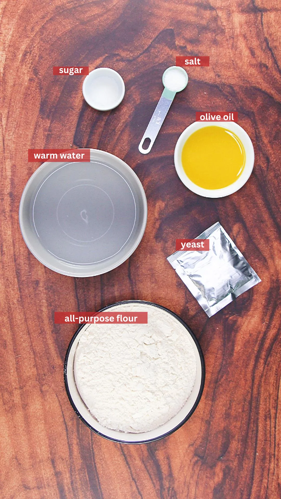Pita Bread Ingredients: sugar, salt, olive oil, warm water, all-purpose flour, and yeast.