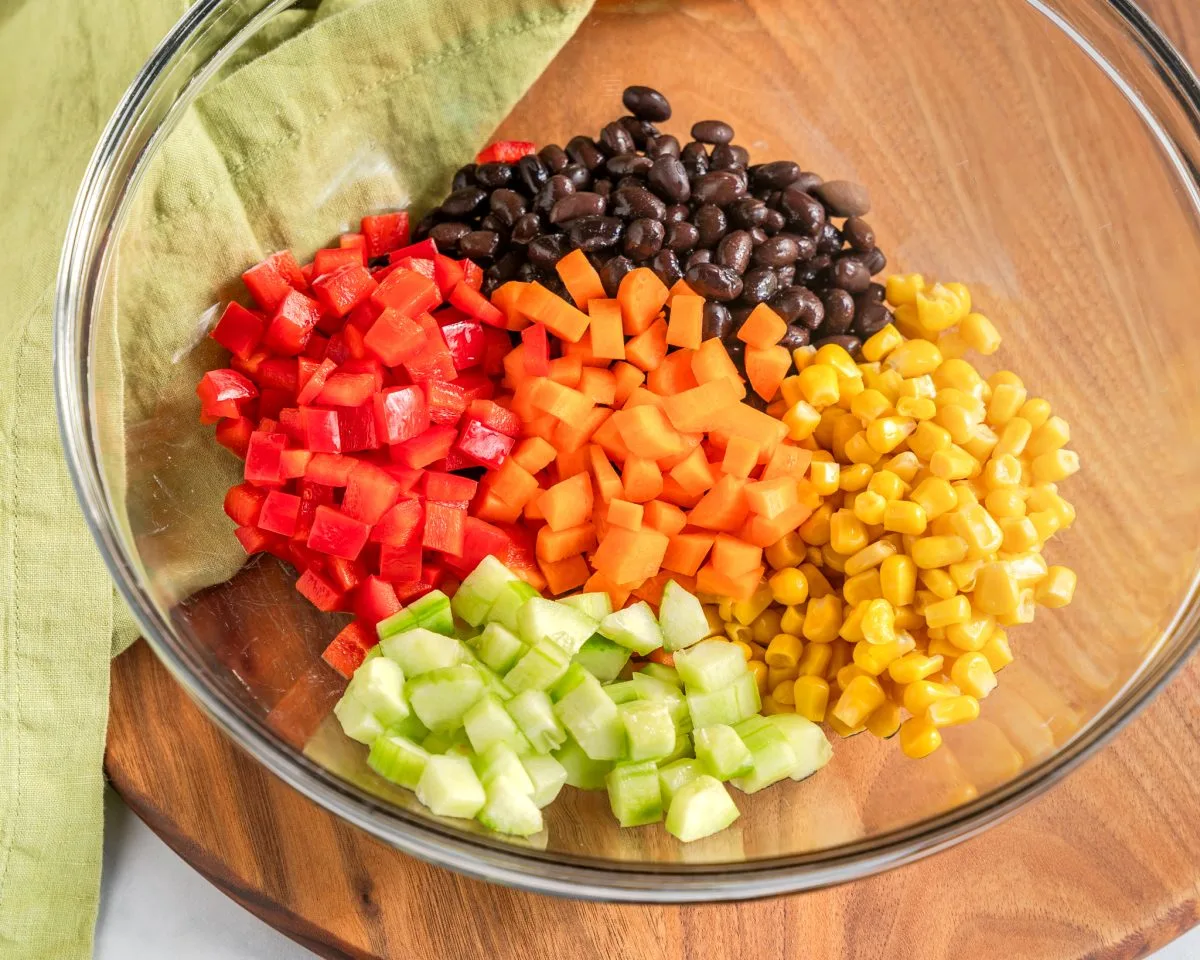 All of the chopped veggies and beans in a large mixing bowl.