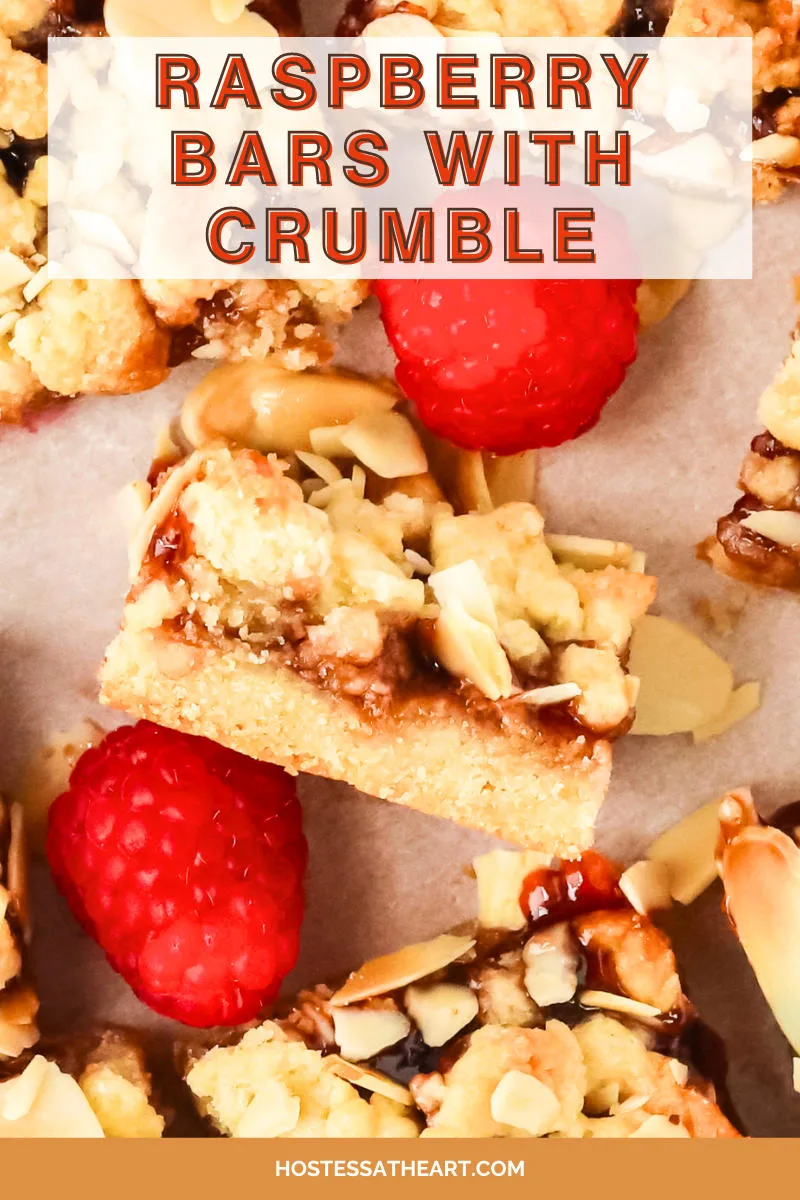 An image for Pinterest of sliced raspberry squares topped with crumble - Hostess At Heart