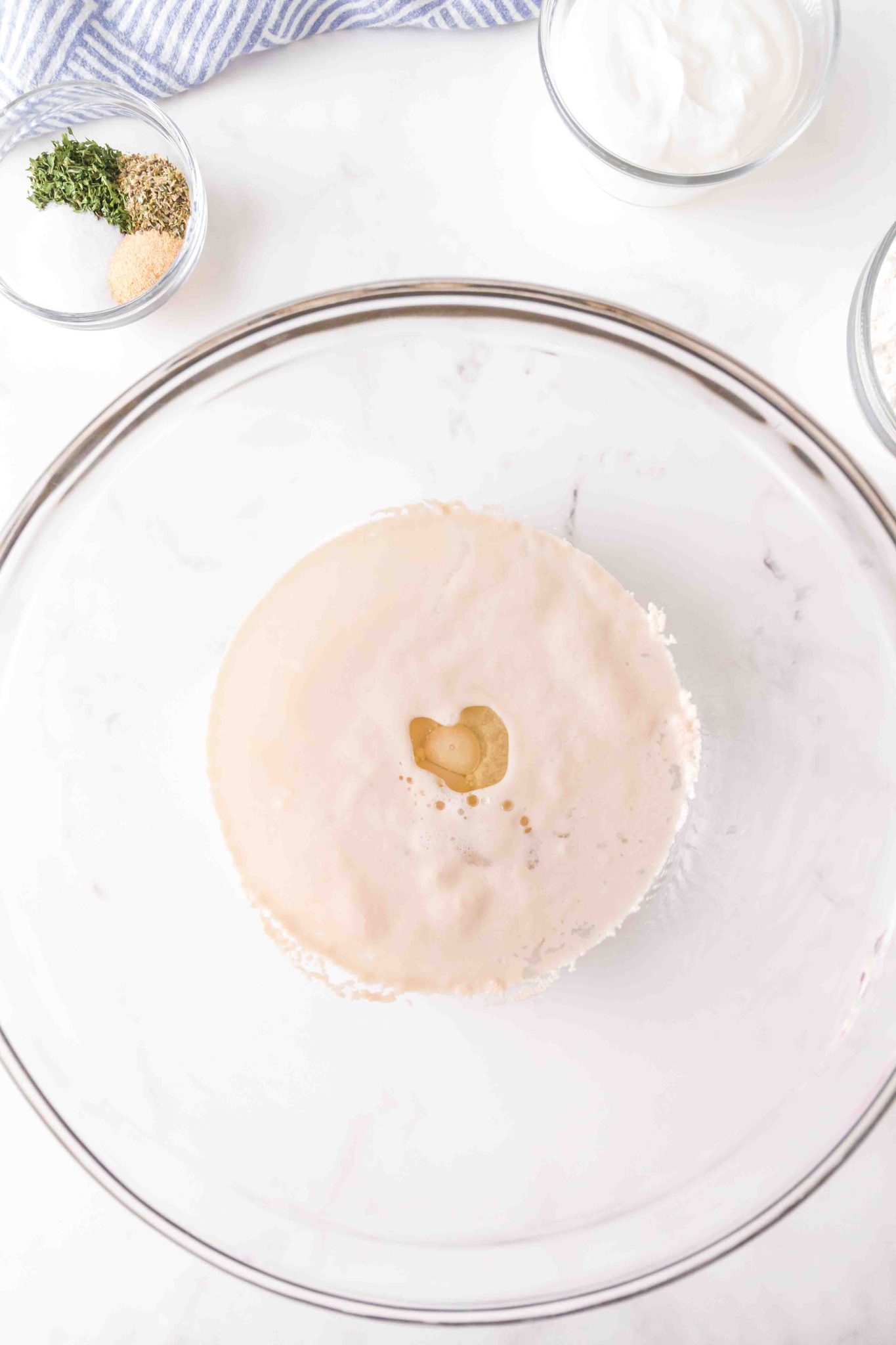 Yeast is proofing in a mixing bowl. Hostess At Heart