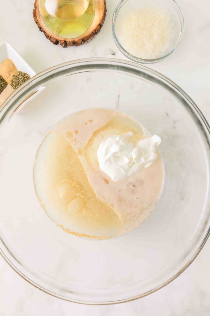 Adding the other liquid ingredients to the yeast in a mixing bowl. Hostess At Heart