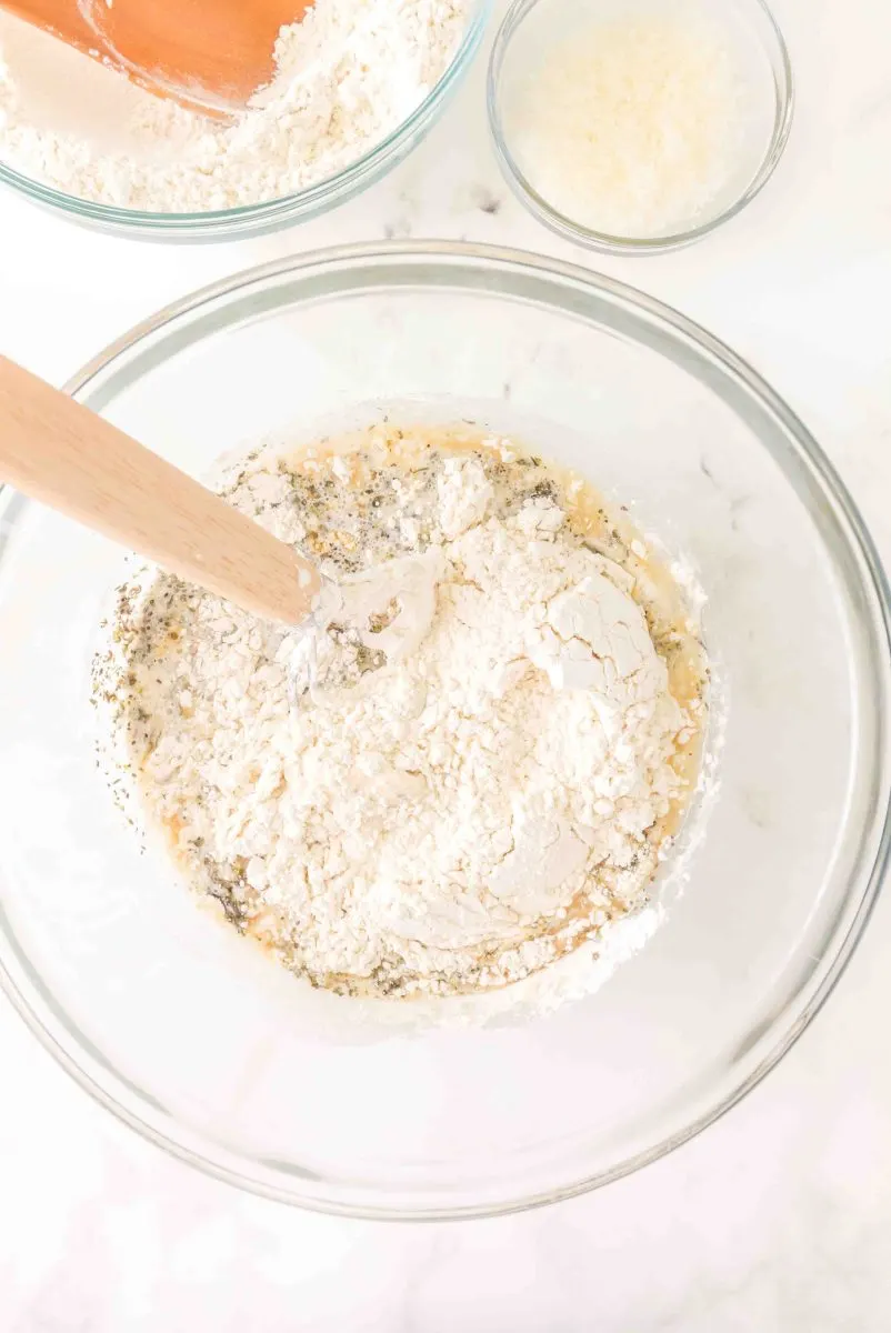 Adding the flour to the mixing bowl.