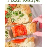 An image for Pinterest of a Margherita flat bread pizza that's been sliced and a hand pulling a slice away from the whole pizza. Hostess At Heart