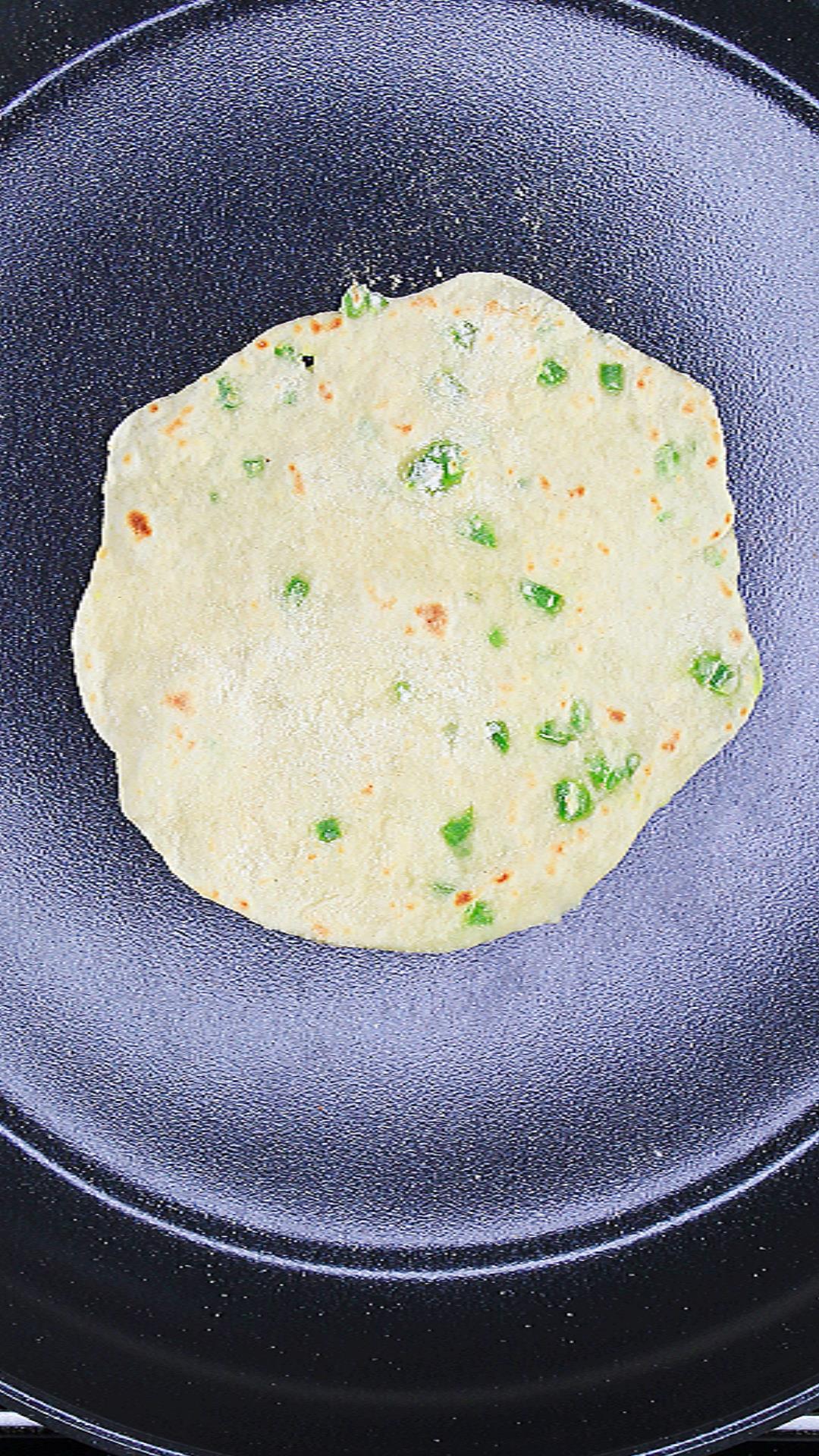 Spicy Tortilla cooking in a skillet.