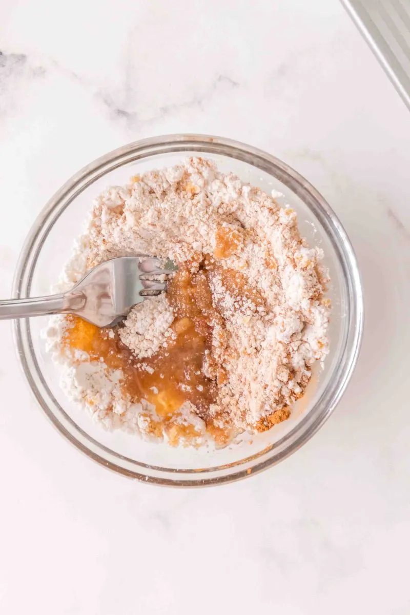 Mixing the streusel topping ingredients in a bowl. Hostess At Heart