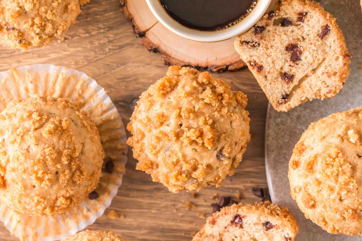 Cappuccino Chocolate Chip Muffins close up, one is cut in half to seee the texture. Hostess At Heart