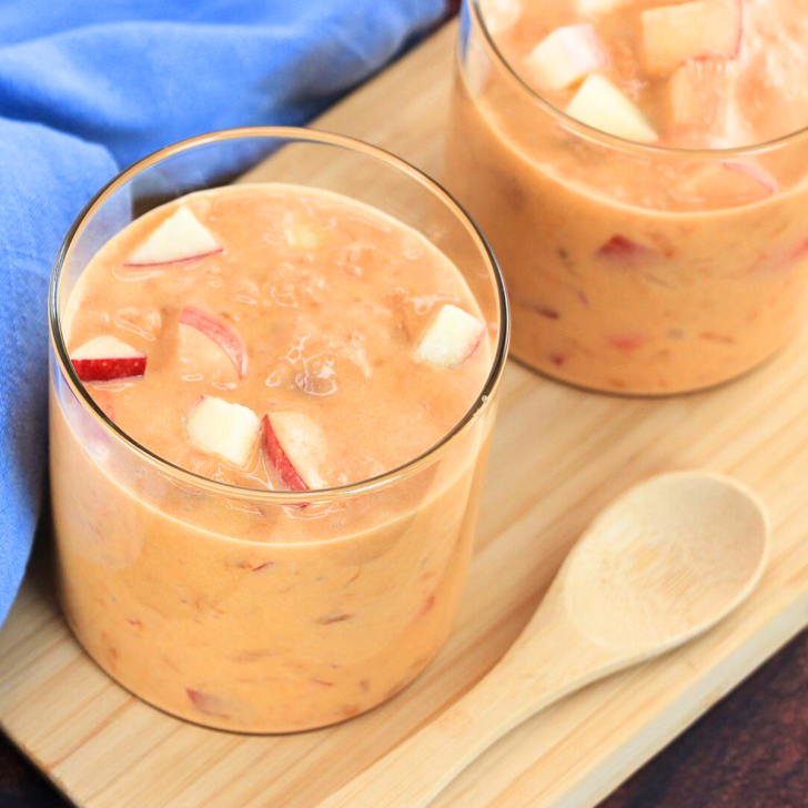 Angled view of two glass dishes filled with a recipe for apple caramel salad. Hostess At Heart