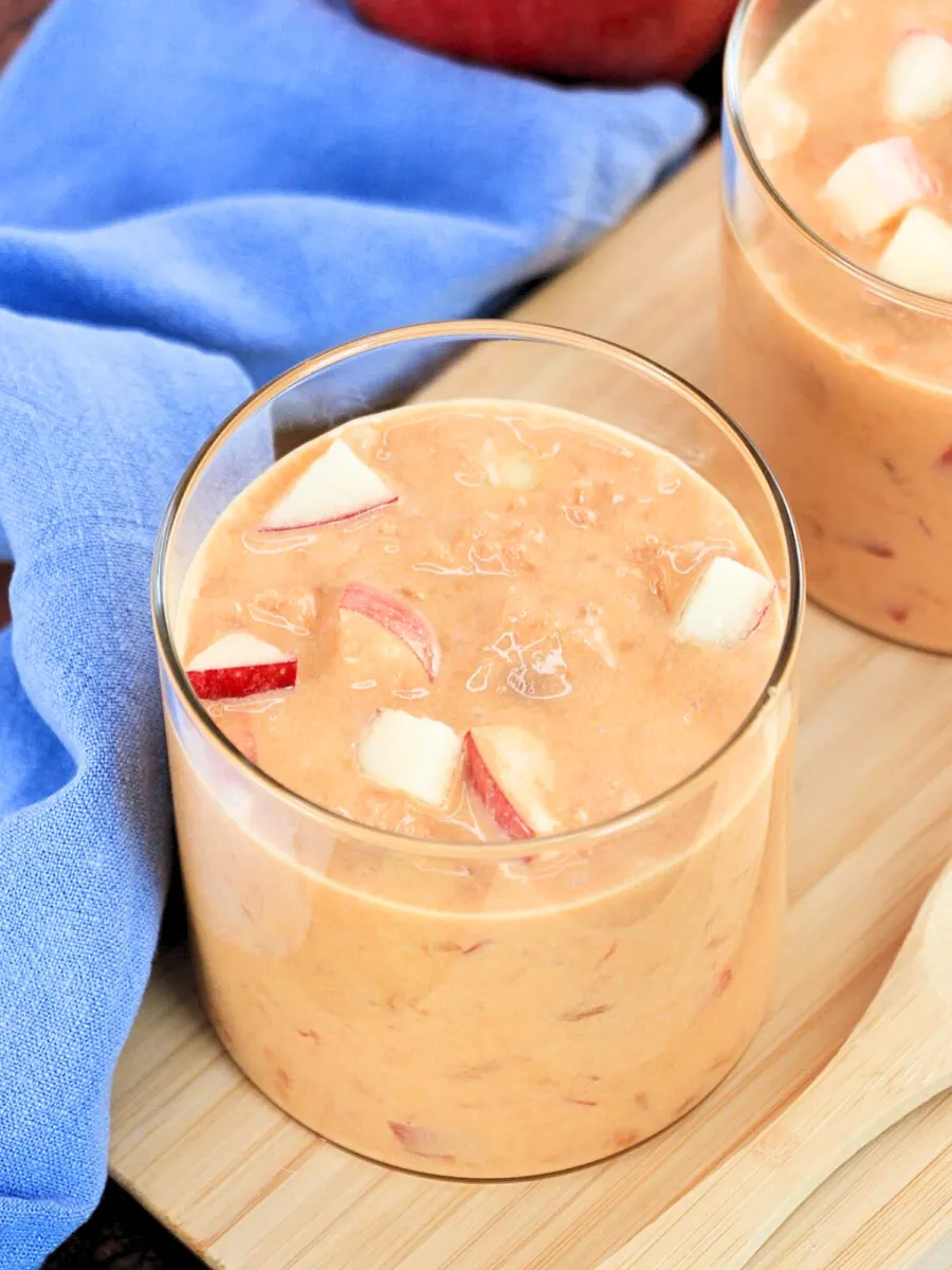 Top down view of a glass jar filled with caramel pudding mixed with fresh apples - Hostess At Heart