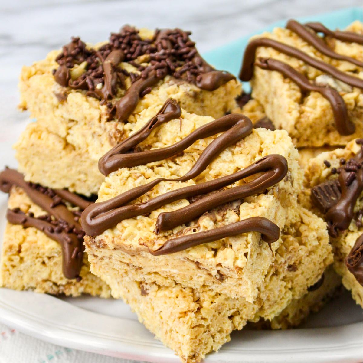 Table view of peanut butter rice crispy treats on a plate.