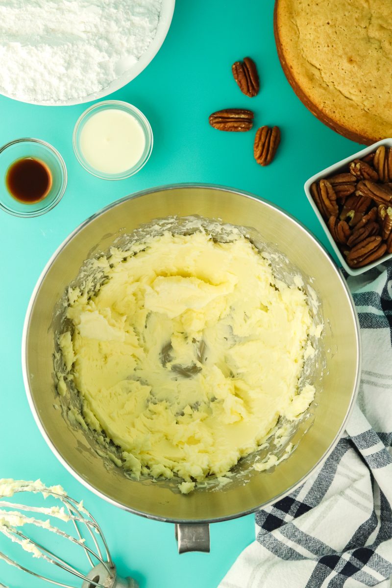 Down view of a mixer bowl filled with whipped butter. Hostess At Heart