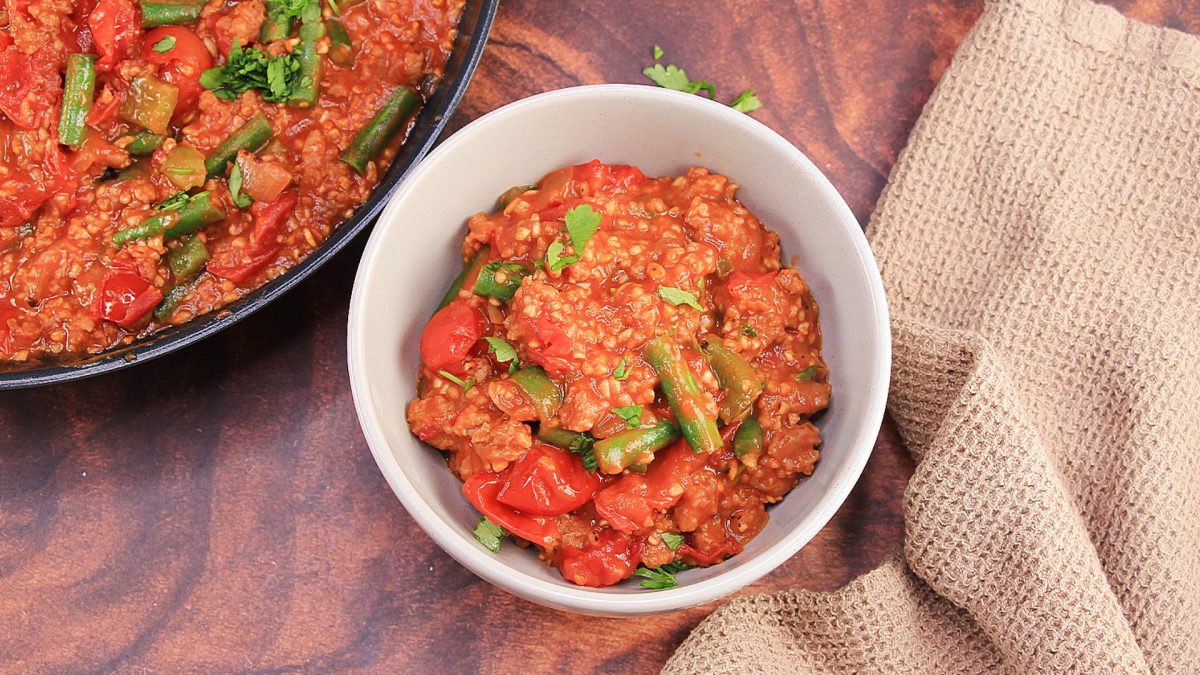 Top down view of a bowl filled with Sausage, Bulgur Wheat, and vegetables. - Hostess At Heart 