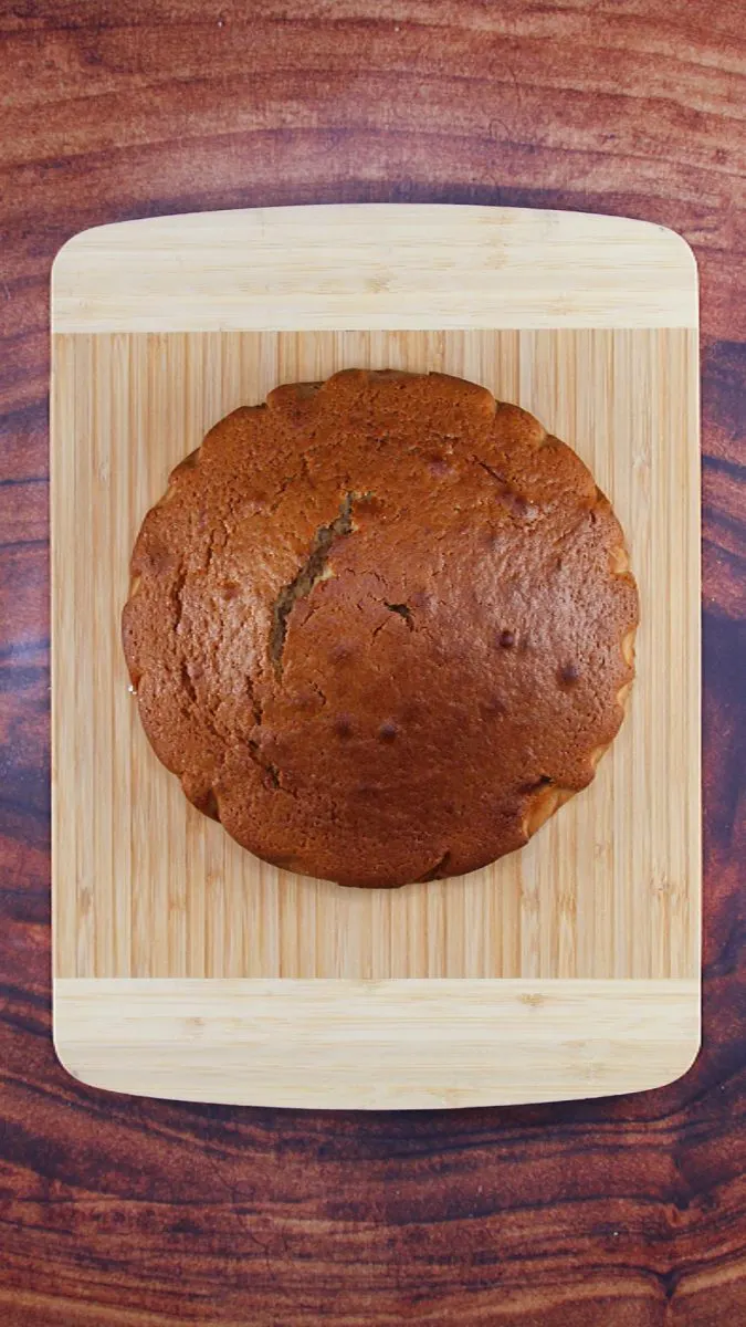 A round cake sitting on a cutting board. Hostess At Heart