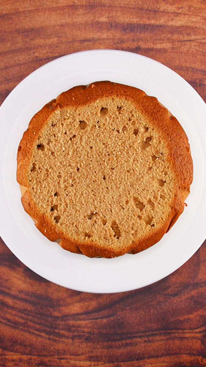 The top of a round cake sliced to even out the top.