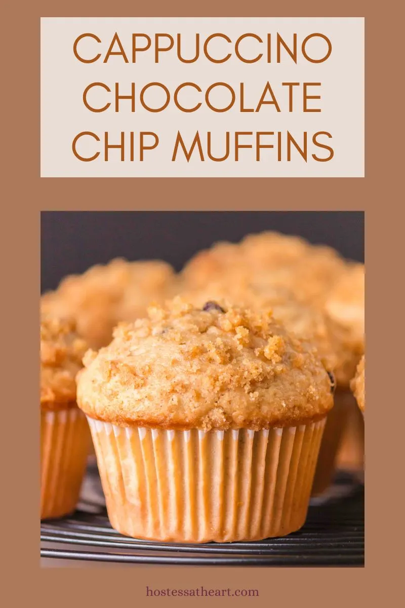 Sideview of a baked muffins with streusel topping for Pinterest. A title label reads Cappuccino Chocolate Chip Muffins - Hostess At Heart