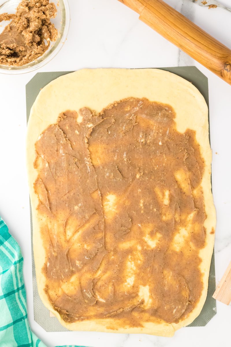 Filling spread over bread dough rolled into a rectangle. Hostess At Heart