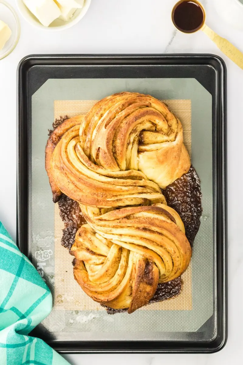 Top down view of baked twist bread with filling cooked out the sides - Hostess At Heart