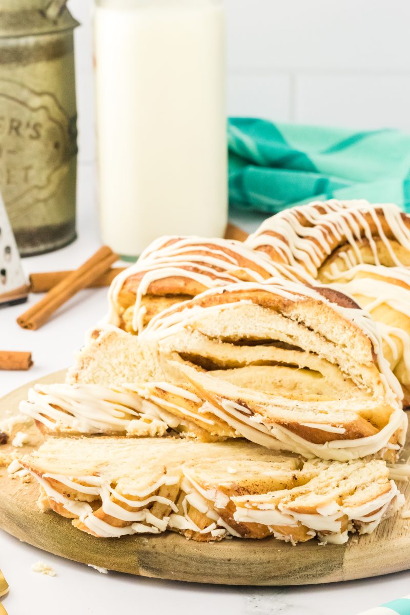 Close up of slices of cinnamon twist bread on a tray with milk in the background.