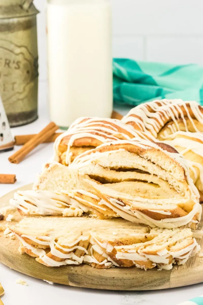 Close up of slices of cinnamon twist bread on a tray with milk in the background.