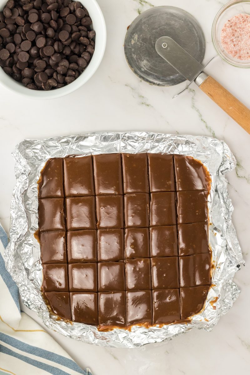 Chilled chocolate caramel ingredients in an 8x8 dish.