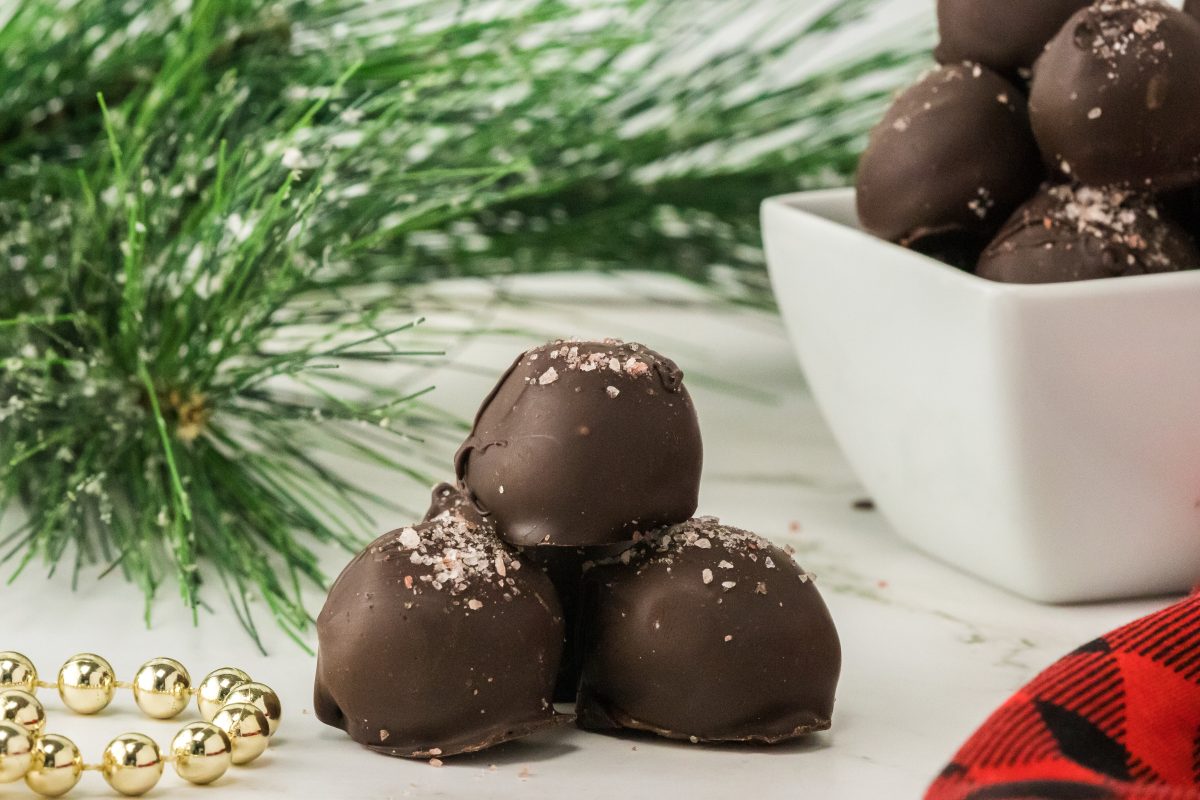 Three salted caramel balls stacked together.