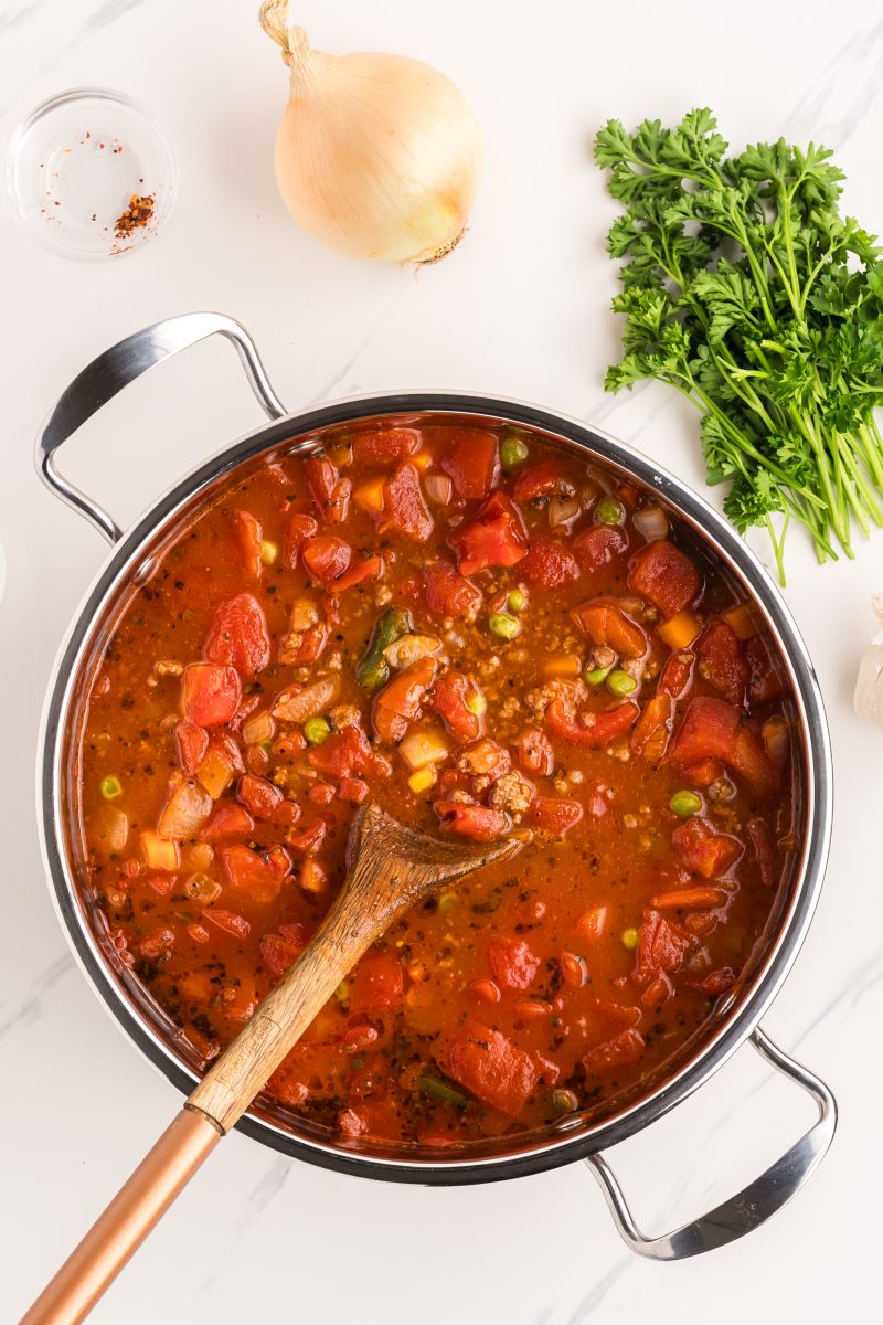 Distance view of soup cooking in a pot. Hostess At Heart