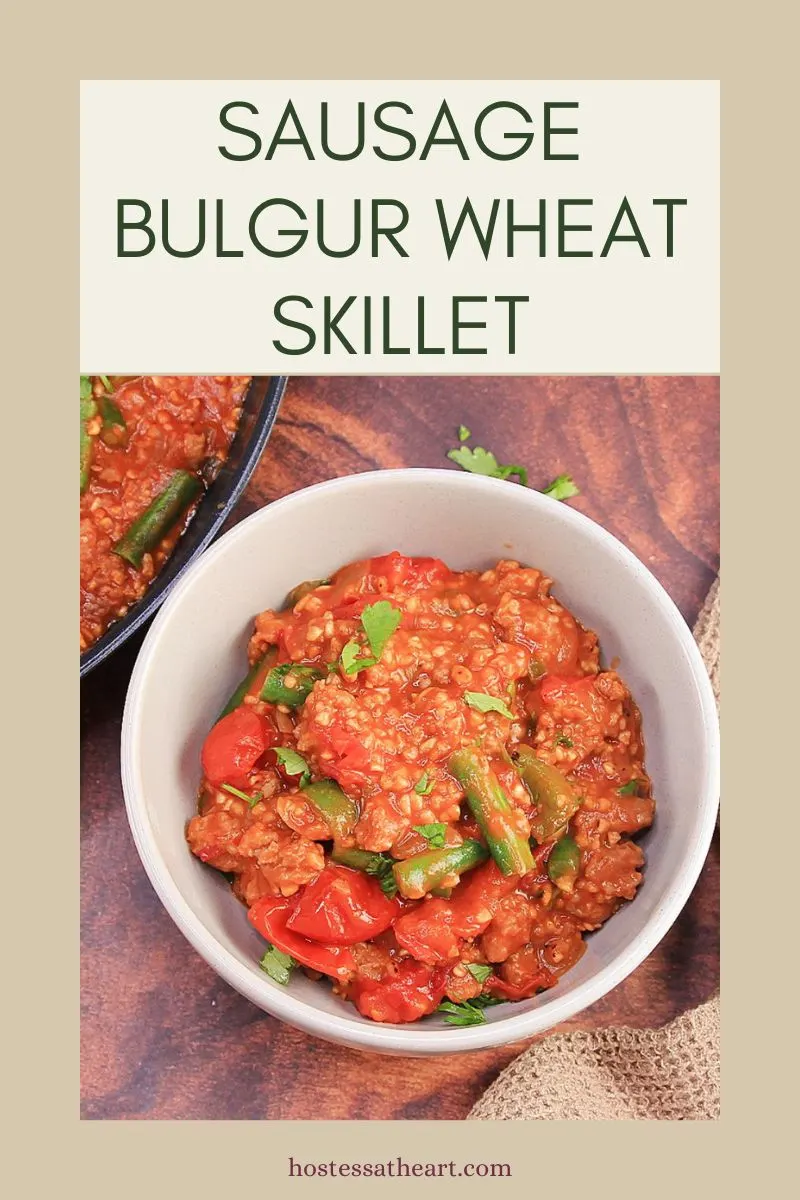 Image for Pinterest of a bowl filled with a skillet recipe for sausage, bulgur wheat, and vegetables - Hostess At Heart