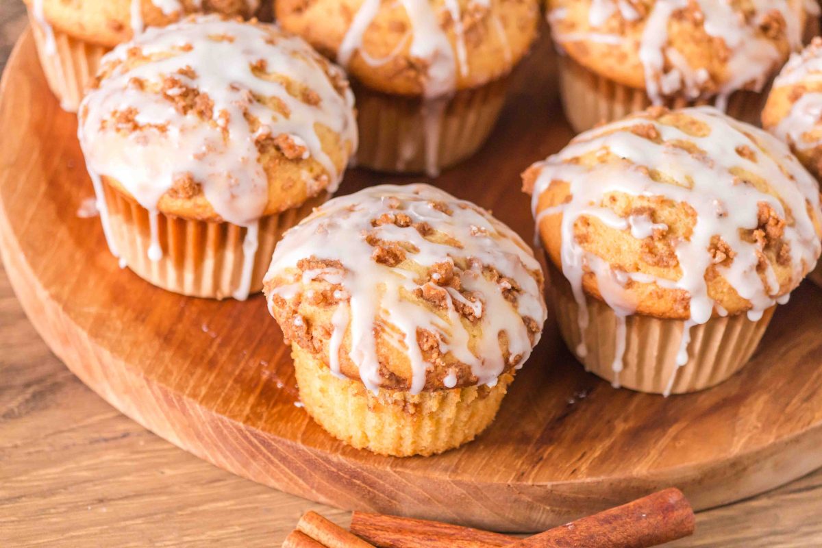 top down image of cinnamon roll muffins showing the drizzled glaze.