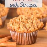 Sideview of a baked gingerbread muffin topped with crunchy streusel topping. Hostess At Heart