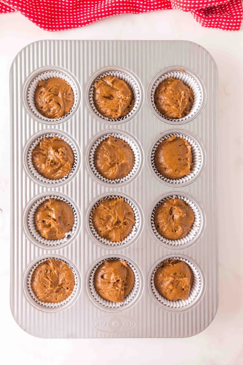 A cupcake pan filled with gingerbread batter. Hostess At Heart